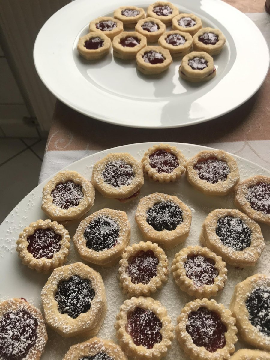 European jam tart cookies dusted with powdered sugar